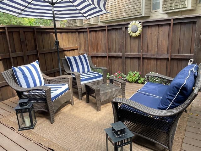 view of patio / terrace featuring fence and a deck