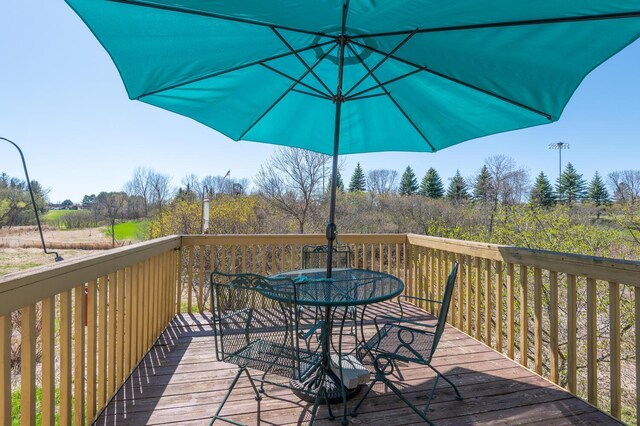 deck featuring outdoor dining space
