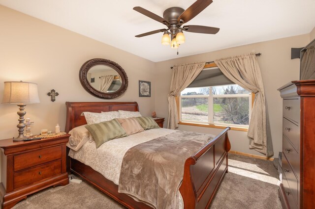 bedroom with baseboards, a ceiling fan, and carpet