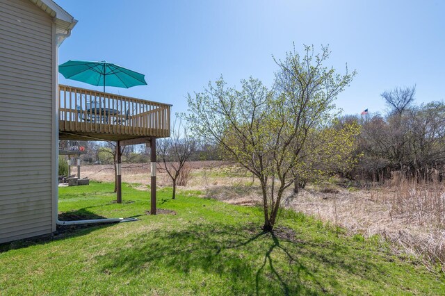 view of yard featuring a wooden deck