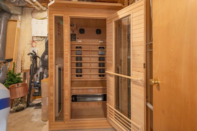 view of sauna featuring concrete flooring