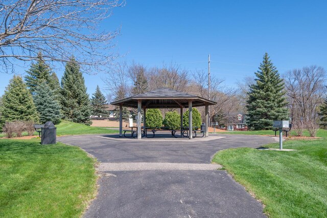 surrounding community featuring a gazebo and a yard