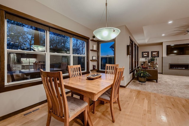 334 143rd Ave NW, Andover, MN 55304 - dining space with wood finished floors, recessed lighting, baseboards, ceiling fan, and a fireplace
