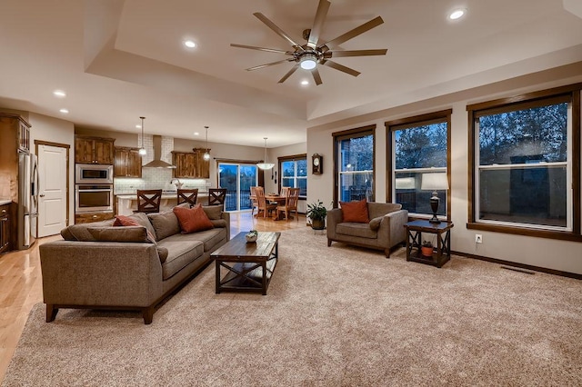 334 143rd Ave NW, Andover, MN 55304 - living area with ceiling fan, recessed lighting, a tray ceiling, and baseboards