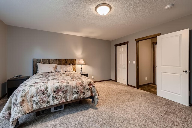 334 143rd Ave NW, Andover, MN 55304 - carpeted bedroom featuring a textured ceiling and baseboards