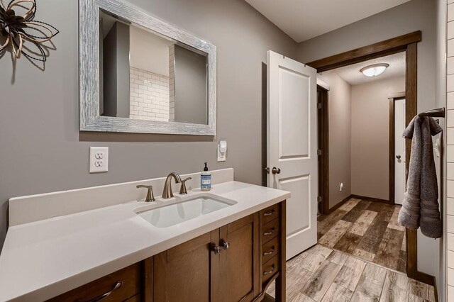 334 143rd Ave NW, Andover, MN 55304 - bathroom featuring vanity and wood finished floors