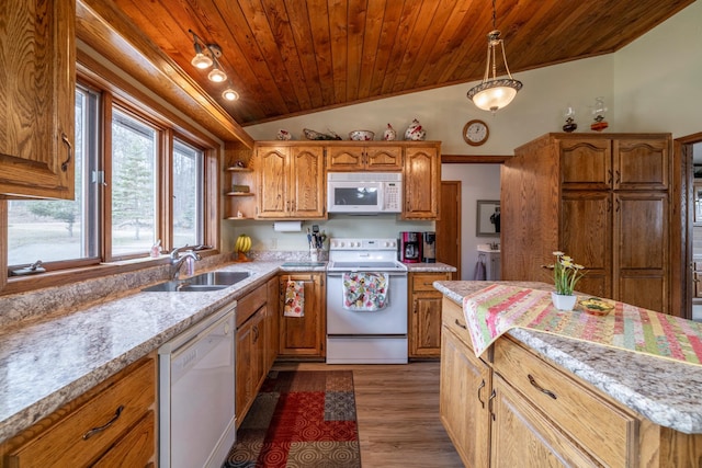 kitchen with wood ceiling, a sink, light countertops, vaulted ceiling, and white appliances