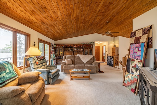 living area featuring wooden ceiling, ceiling fan, vaulted ceiling, and carpet floors