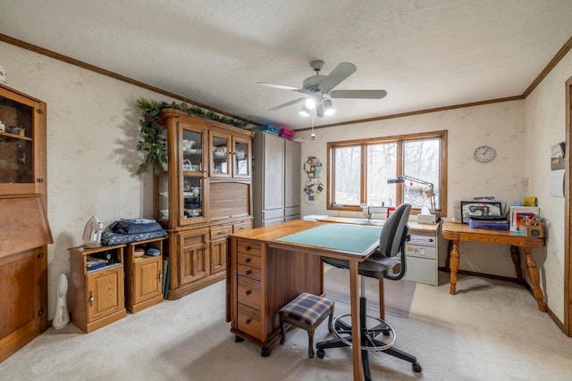 home office with a textured ceiling, light colored carpet, crown molding, and a ceiling fan
