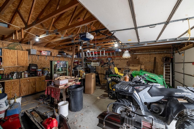 garage featuring a workshop area and a garage door opener