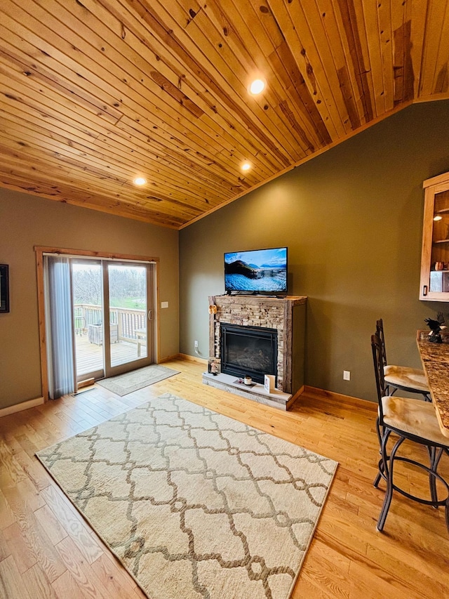 1008 Ruby St NW, Alexandria, MN 56308 - unfurnished living room with wooden ceiling, a fireplace, vaulted ceiling, light wood-type flooring, and baseboards