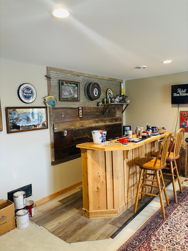 1008 Ruby St NW, Alexandria, MN 56308 - indoor dry bar with recessed lighting, light wood-style flooring, and baseboards