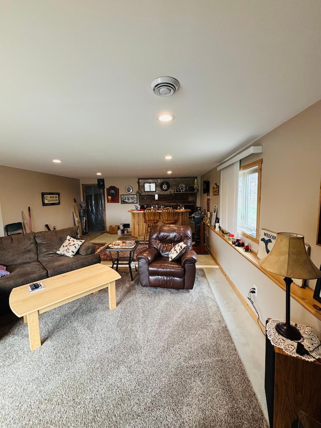 1008 Ruby St NW, Alexandria, MN 56308 - living room featuring a bar, recessed lighting, and carpet