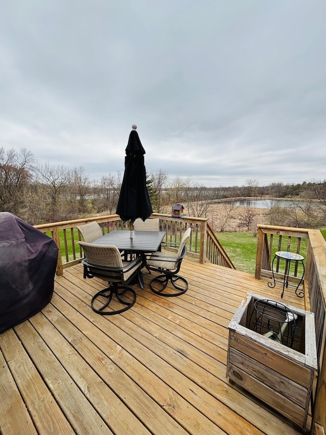 1008 Ruby St NW, Alexandria, MN 56308 - wooden deck featuring a water view and outdoor dining area