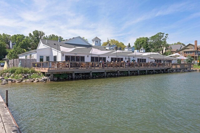 view of dock with a deck with water view