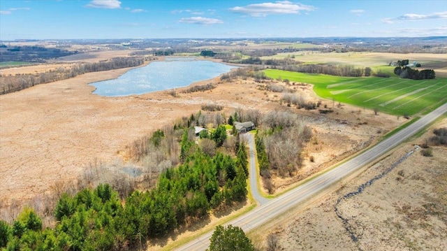 birds eye view of property with a rural view and a water view