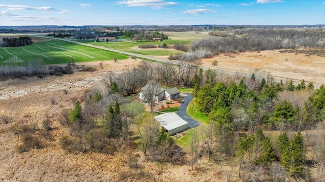 birds eye view of property with a rural view