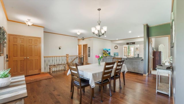 dining space with a chandelier, recessed lighting, wood finished floors, and ornamental molding