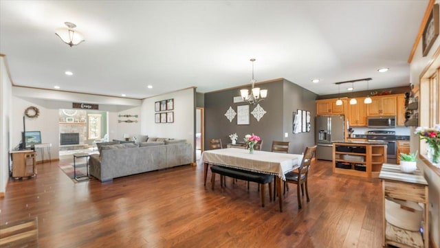 dining room with recessed lighting and dark wood-type flooring