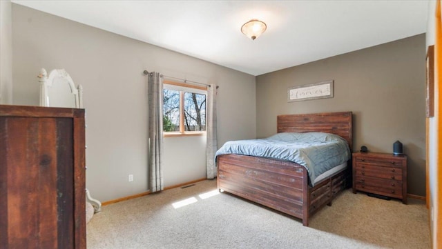 bedroom with baseboards and carpet flooring