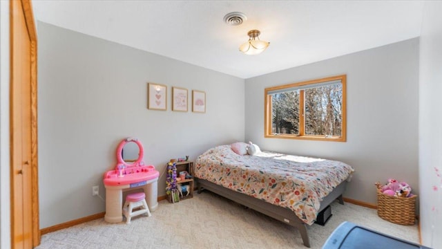 bedroom featuring visible vents, carpet flooring, and baseboards