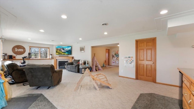 living room with recessed lighting, a fireplace, visible vents, baseboards, and light colored carpet