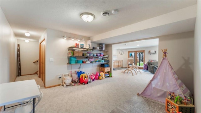 playroom with carpet flooring and baseboards