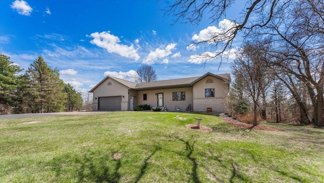 single story home featuring aphalt driveway, a front yard, and an attached garage