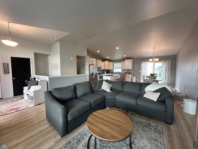 6054 59th St S, Fargo, ND 58104 - living area featuring light wood-style floors, a notable chandelier, recessed lighting, and lofted ceiling