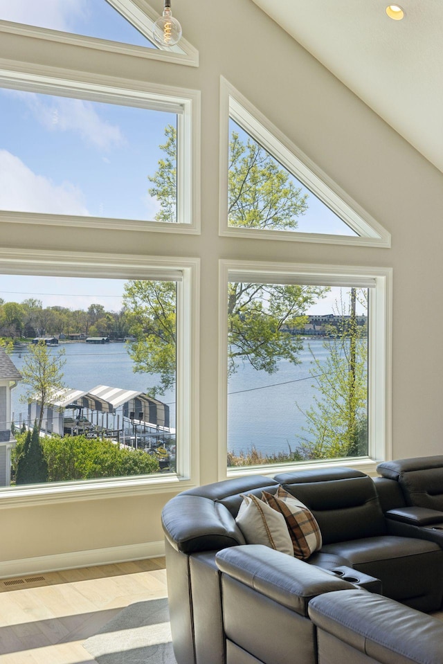 1929 Fagerness Point Rd, Orono, MN 55391 - living area featuring a water view, plenty of natural light, wood finished floors, recessed lighting, and baseboards