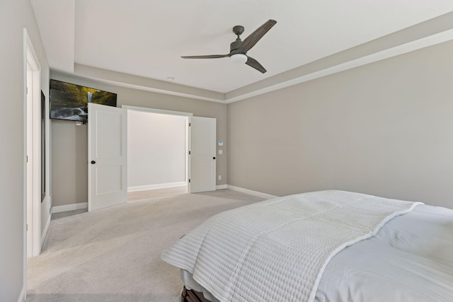 1929 Fagerness Point Rd, Orono, MN 55391 - bedroom with light colored carpet, baseboards, and a ceiling fan