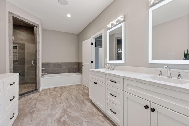 1929 Fagerness Point Rd, Orono, MN 55391 - full bathroom with a garden tub, a stall shower, double vanity, marble finish flooring, and recessed lighting