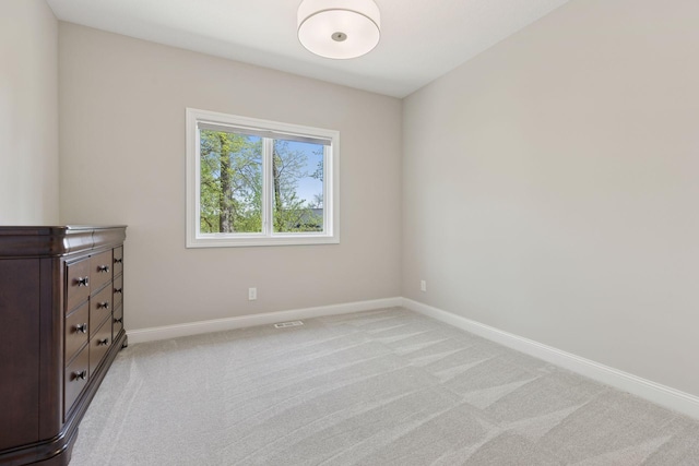1929 Fagerness Point Rd, Orono, MN 55391 - unfurnished bedroom featuring baseboards and light colored carpet