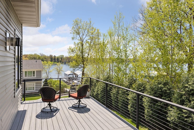 1929 Fagerness Point Rd, Orono, MN 55391 - wooden deck featuring a water view and view of scattered trees