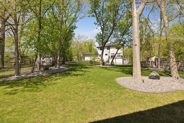 1929 Fagerness Point Rd, Orono, MN 55391 - view of yard featuring a fenced backyard and stairs