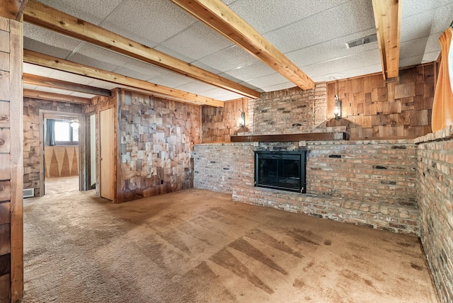 below grade area with wooden walls and carpet