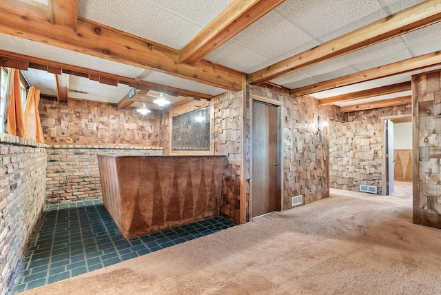 basement with carpet flooring and visible vents