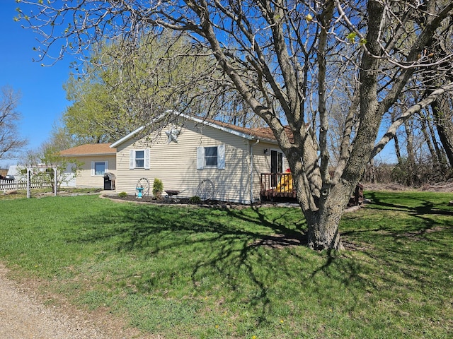 12405 State Highway 91, Leota Twp, MN 56155 - view of side of property featuring a yard and a wooden deck