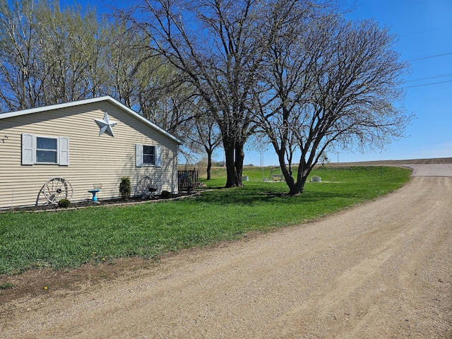 12405 State Highway 91, Leota Twp, MN 56155 - view of side of home with a lawn