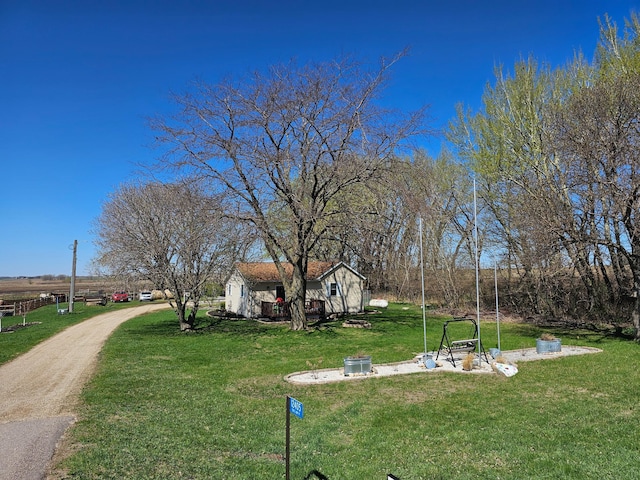 12405 State Highway 91, Leota Twp, MN 56155 - view of grassy yard with an outdoor structure