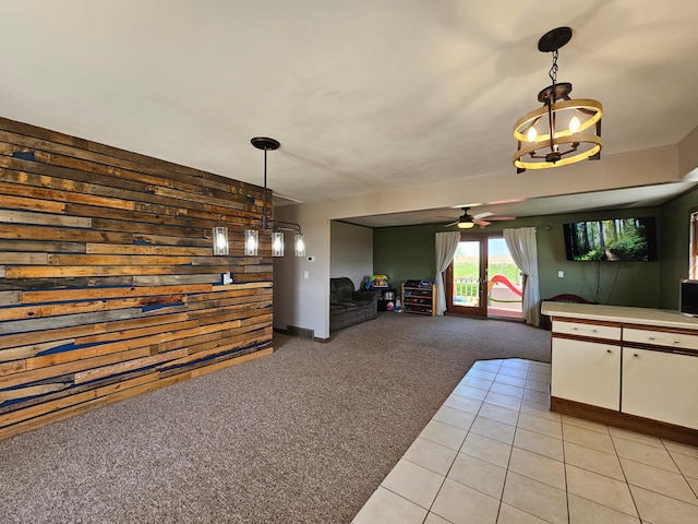 12405 State Highway 91, Leota Twp, MN 56155 - unfurnished dining area featuring light colored carpet, a ceiling fan, and light tile patterned flooring
