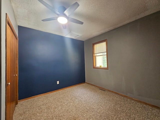 12405 State Highway 91, Leota Twp, MN 56155 - carpeted empty room with a textured ceiling and a ceiling fan