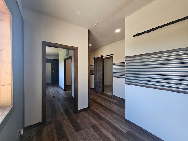 12405 State Highway 91, Leota Twp, MN 56155 - hall with a barn door, dark wood-style floors, and recessed lighting