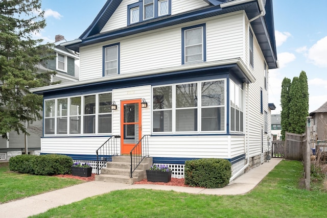2012 Selby Ave, Saint Paul, MN 55104 - american foursquare style home featuring a sunroom, a front yard, fence, and entry steps