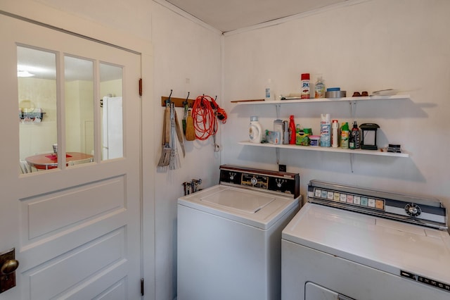 laundry area with washing machine and clothes dryer