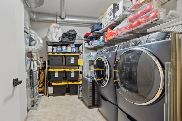 washroom featuring laundry area and washing machine and dryer