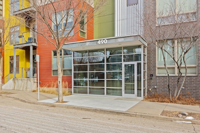 property entrance with brick siding