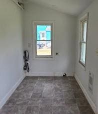 washroom with baseboards