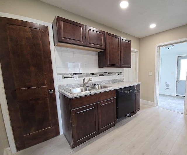 kitchen featuring dark brown cabinetry, light countertops, backsplash, dishwasher, and a sink