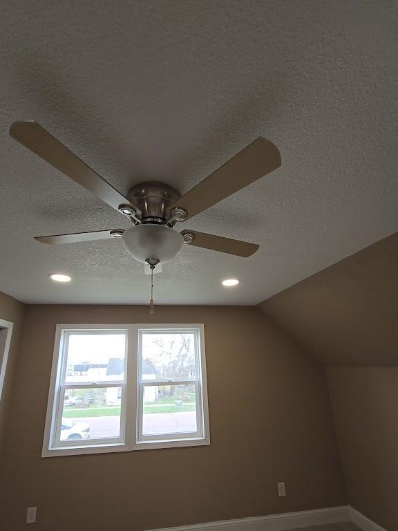 room details with a textured ceiling, ceiling fan, recessed lighting, and baseboards